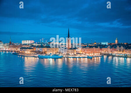 Panoramic view of famous Stockholm city center with historic Riddarholmen in Gamla Stan old town district during blue hour at dusk Stock Photo
