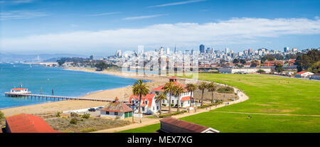 Panoramic view of San Francisco skyline with historic Crissy Field and former USCG Fort Point Life Boat Station (LBS) in the foreground, California Stock Photo