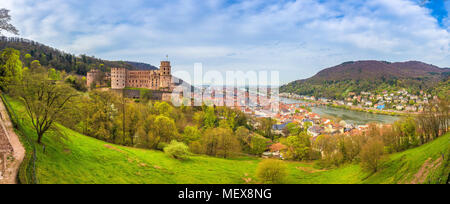 Panoramic view of the old town of Heidelberg with famous Heidelberg Castle on a beautiful sunny day with blue sky and clouds in springtime, Germany Stock Photo
