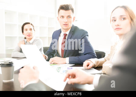 Business employees listening to boss Stock Photo
