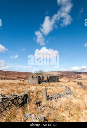 A derelict abandoned and Edwardian farmhouse on the moorland of Calderdale in West Yorkshire Stock Photo