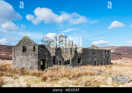 A derelict abandoned and Edwardian farmhouse on the moorland of Calderdale in West Yorkshire Stock Photo