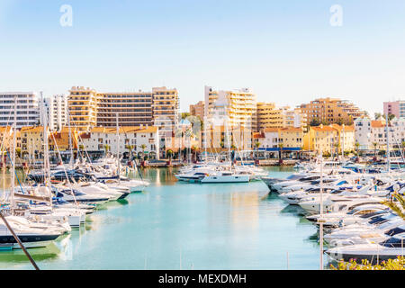 Marina full of luxurious yachts in touristic Vilamoura, Quarteira, Algarve, Portugal Stock Photo