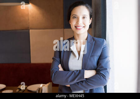 Cheerful successful female restaurateur Stock Photo