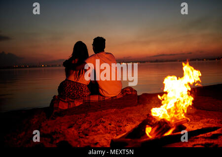Romantic date on beach at night Stock Photo