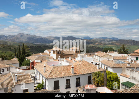 view from roof of the Iglesia de Santa Maria la Mayor church over the old town to the mountains of the Sierra de Grazalema, Ronda, Andalucia, Spain Stock Photo