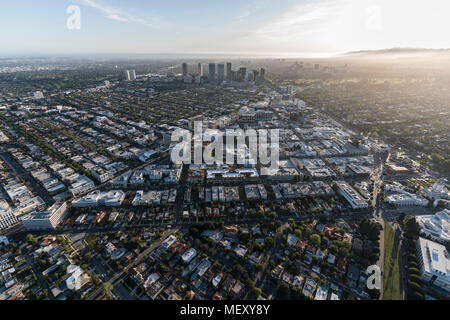 Afternoon aerial view of Beverly Hills streets with mid Wilshire and ...