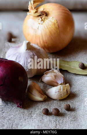 Garlic and shallots on sackcloth texture background close up Stock Photo
