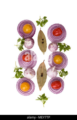 Top view. Slices of red onion, garlic, tomatoes, bay leaves with pepper and basil. Stock Photo