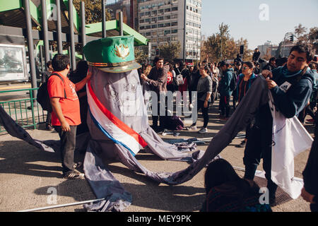 Santiago, Chile - April 19, 2018: Students prepare a doll to join the march against the profit in education Stock Photo