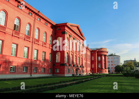 The main (red) bulding of Kyiv National Taras Shevchenko University. View from the park during early autmn. Stock Photo