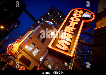 Atlanta capital of the U.S. state of Georgia, Exterior of Hooters bar neon sign outside their Downtown Peachtree restaurant at night Stock Photo