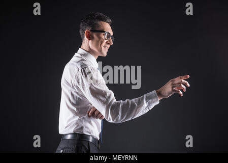 Cheerful happy man using computer panel Stock Photo