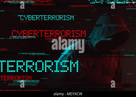 Cyberterrorism concept with faceless hooded male person, low key red and blue lit image and digital glitch effect Stock Photo