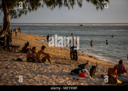 A man rides a fat bike along the beach at Saint-Gilles on the Indian Ocean Island of La Reunion. Stock Photo