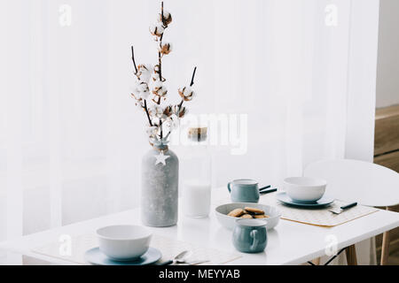 scandinavian style hipster interior, cozy loft room, vase with cotton in the interior Stock Photo