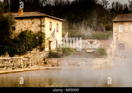 In the center of Bagno Vignoni dominates the old thermal pool. Today the pool is a protected monument and bathing is forbidden here. But the charm of the old bathing place is perfectly preserved. Several cafes and restaurants line the historic site, which has often been the backdrop for films. Stock Photo