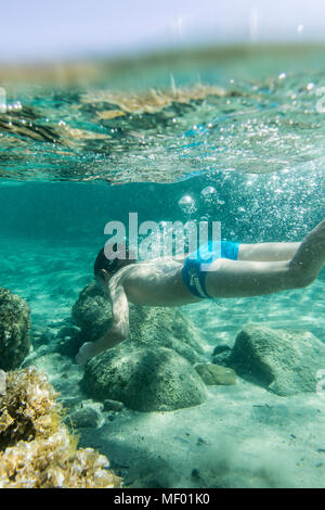 Snorkeling in the turquoise sea of Sant Elmo Castiadas Costa Rei Cagliari Sardinia Italy Europe Stock Photo