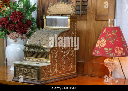 Images of Antique National 313 cash register, manufactured in 1912 by National Cash Register Co. Shown is front view of bronze cash register. Stock Photo
