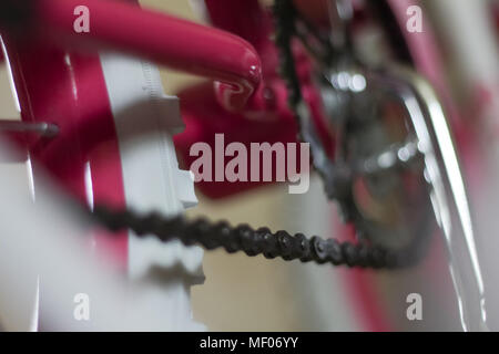 pink child's bicycle closeup with white wheels Stock Photo