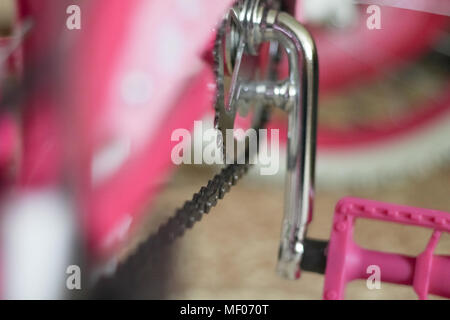 pink child's bicycle closeup with white wheels Stock Photo