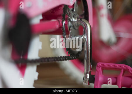 pink child's bicycle closeup with white wheels Stock Photo