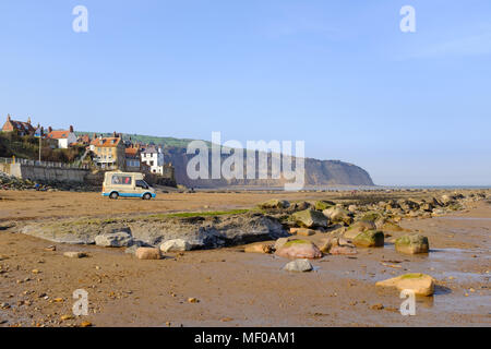 ROBIN HOOD'S BAY, APRIL 21: Traditional ice cream van on Robin Hood's Bay beach. In Robin Hood's Bay, England. On 21st April 2018. Stock Photo