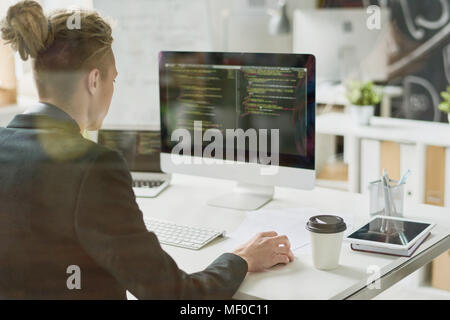 Talented coder working with computer language Stock Photo