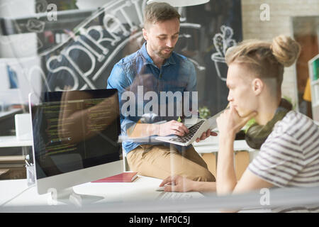Hipster programmers creating new website script Stock Photo