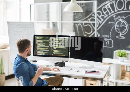 Modern developer thinking of application code Stock Photo