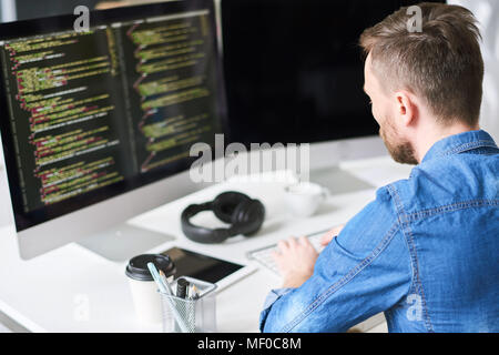 Developing software on computer Stock Photo