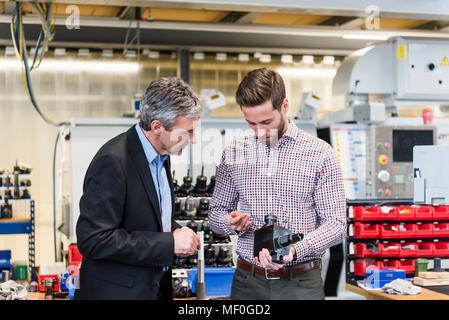 Businessmen during meeting with product Stock Photo