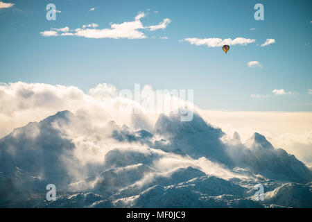Austria, Salzkammergut, Hot air balloon over Dachstein massif Stock Photo