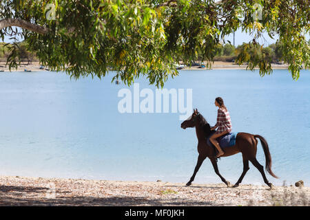 Indonesia, Bali, Woman riding a horse at beach Stock Photo - Alamy