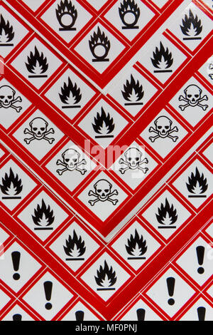 A sheet of various CLP Regulation/GHS chemical warning labels including Oxidising, Flammable, Acute toxicity and Health hazard. Stock Photo