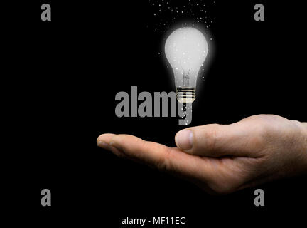 Hand with Floating Light Bulb Stock Photo