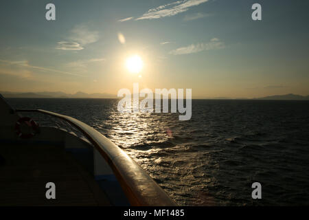 Sunset from the deck of a cruise ship, cruising the Mediterranean Sea. Stock Photo