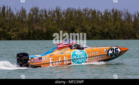 Key Biscayne, Florida, USA. 22nd Apr, 2018. Team Visit St. Petersburg/Clearwater (35) waves the American flag at the crowd as they finish the last practice lap to start the P1 SuperStock USA race during the 2018 Miami Grand Prix P1 event held at the Miami Marine Stadium of Key Biscayne, Florida, USA. Mario Houben/CSM/Alamy Live News Stock Photo