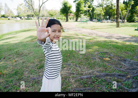 girl showing OK sign Stock Photo