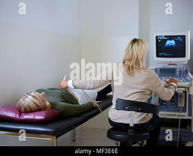 Woman in hospital getting sonogram Stock Photo