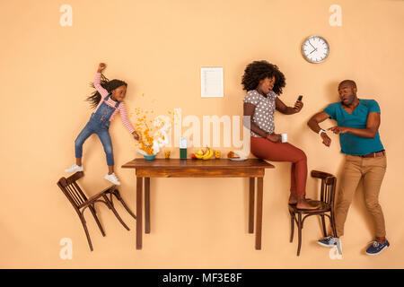 Stressed out family having breakfast in the kitchen Stock Photo