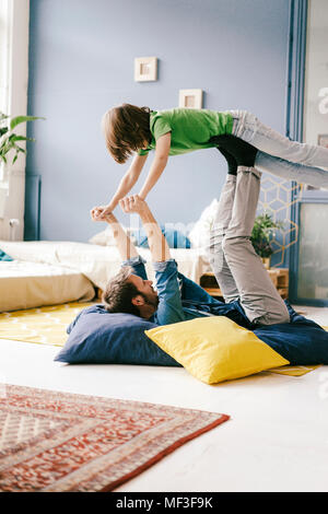 Happy father and son playing at home Stock Photo