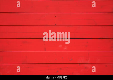 Wooden red background with horizontal planks. Vintage empty surface, close up view. Stock Photo