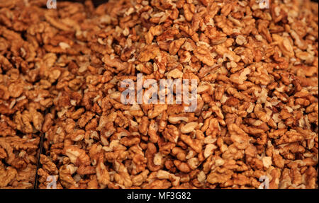 Peeled walnuts kernels background, proper snack for vegan, vegetarian and people on diet. Top view. Stock Photo