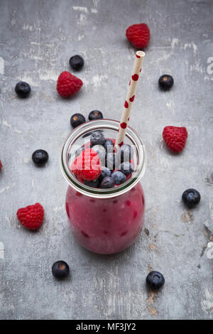 Glass bottle of berry smoothie Stock Photo