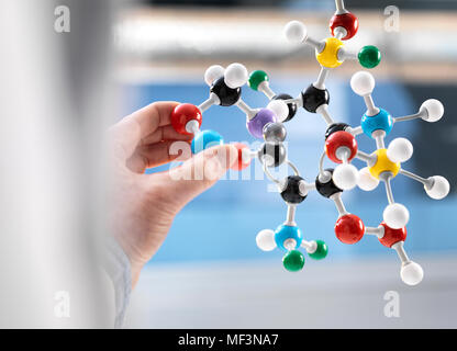 Scientist holding a molecular model Stock Photo