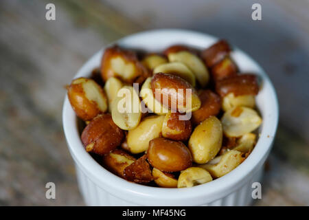 close up of beer nuts in a white bowl Stock Photo