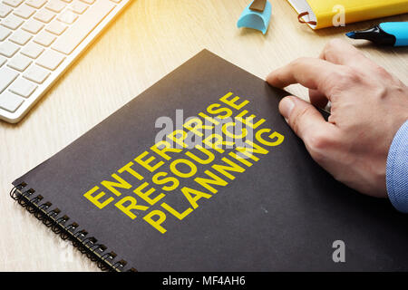 ERP Enterprise Resource Planning book on a table. Stock Photo