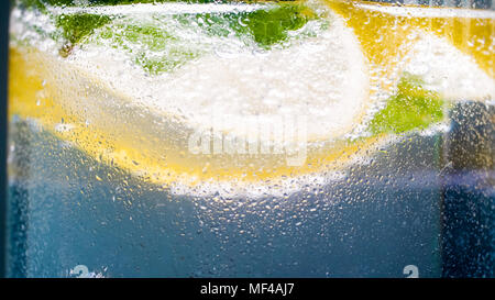 Macro image of cold glass of lemoned covered in small droplets Stock Photo