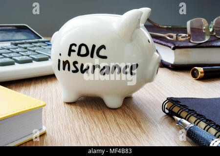FDIC insurance policy on an office desk. Stock Photo